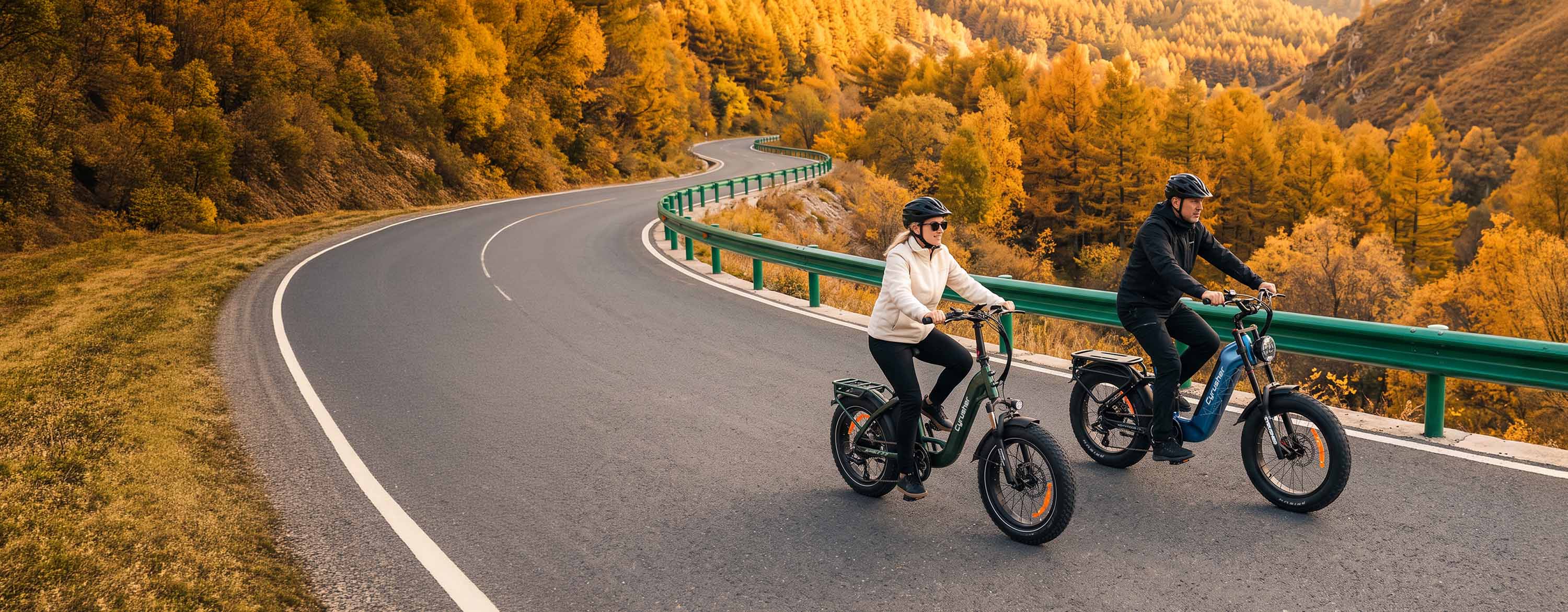 Two riders on Cyrusher electric bikes on an autumn road